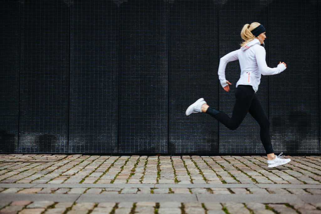 How much cardio should I do: A woman runs in the city