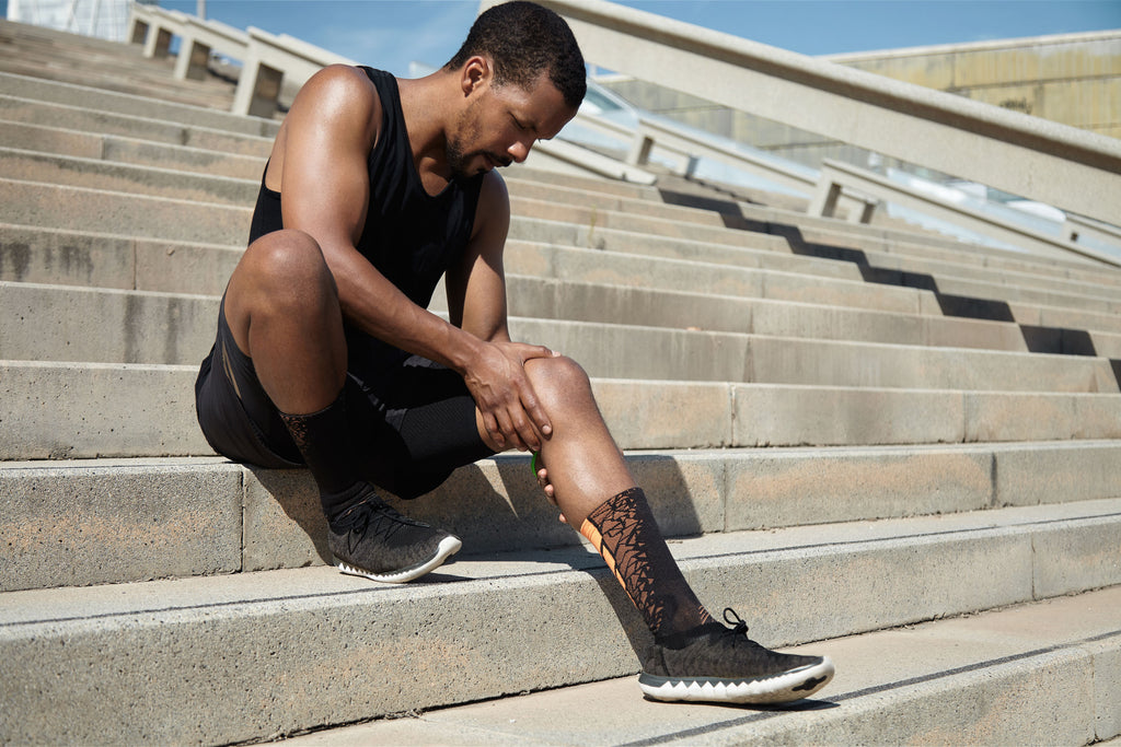How much cardio should I do: A man holds his knee after exercise