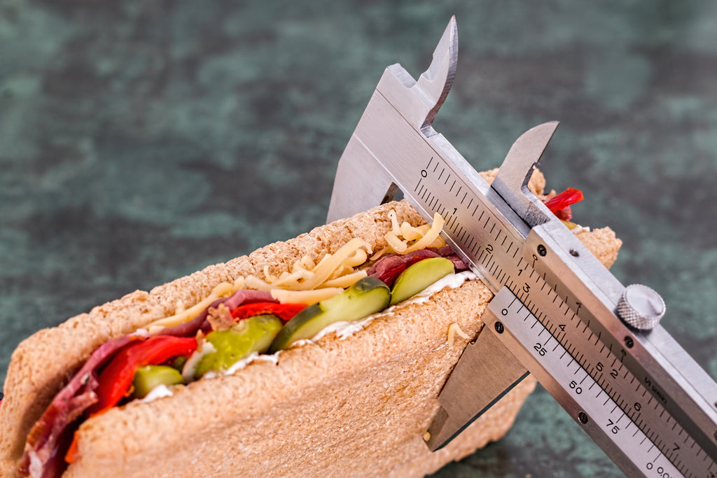 Measuring tool used to measure the width of a healthy sandwich for diet restrictions