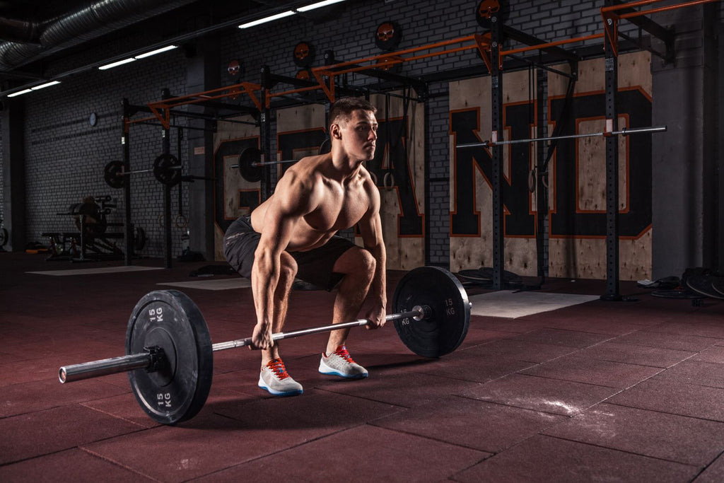 Man doing deadlifts in gym