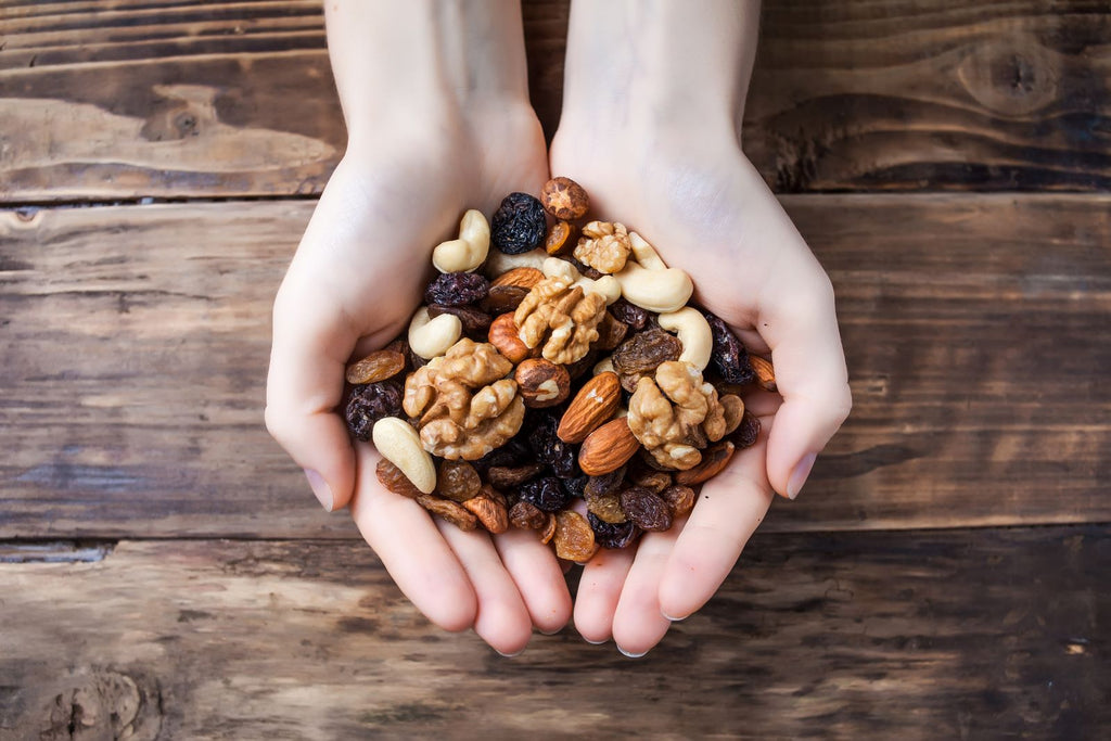 Low carb snacks: Hands cupping homemade granola