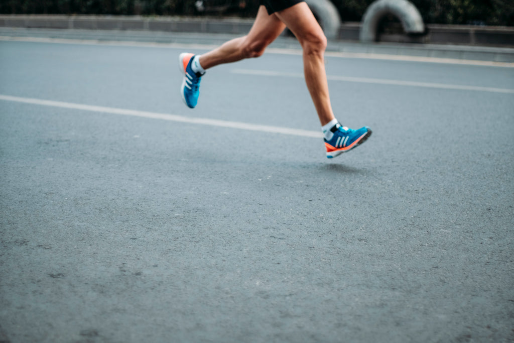 How much cardio should I do: A jogger runs on the pavement